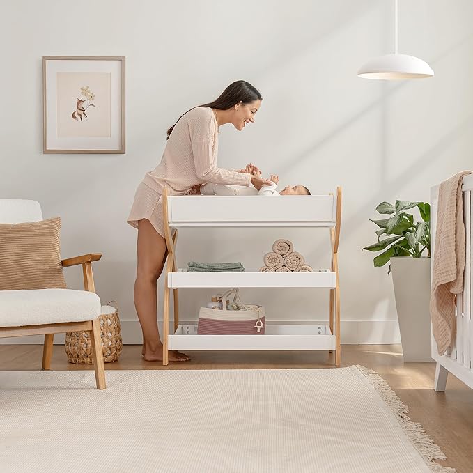 Comfy Cubs Baby Changing Table - Sturdy Wood Construction, Timeless Look Baby Change Table with Two Open Shelves for Infant Daycare Essentials Storage - White with Natural Wood Legs